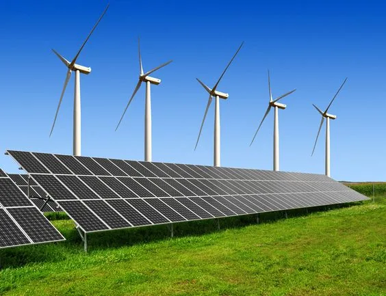Large solar array alongside wind turbines