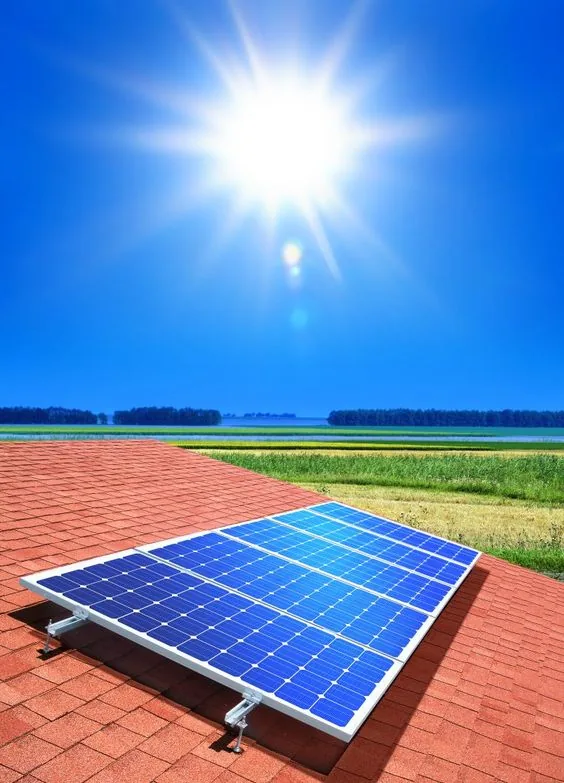Solar panel on a tiled roof under bright sun