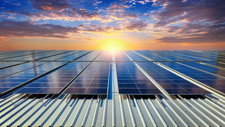 Rooftop solar panels at sunset